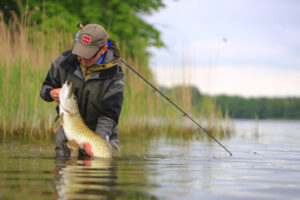 All Inclusive Denmark Fly Fishing Lodge, with Get Lost in America, releasing a pike caught on a fly
