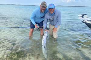 Bahamas Lost Key Lodge Fly Fishing Expeditions releasing a barracuda caught on a fly