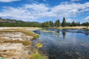 Crossing the Bridge over the Fire Hole river to Biscuit Geyser Basin. Yellowstone Cabin Rentals at Get Lost in America