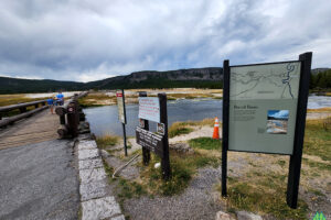 Approaching Fire Hole River to cross bridge into Biscuit Basin Yellowstone National Park for a hike through the geyser basin and up to Mystic Falls