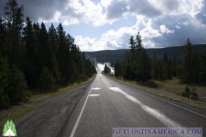 Down the road beyond the mist heading back to our Yellowstone Cabin Rental