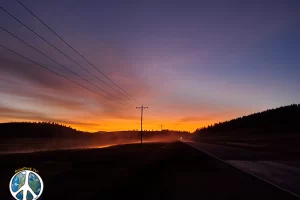 Fence posts of the buffalo corral are but silhouettes in dawns light.