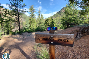 Wigwam trail sign at trailhead, I was wearing Optic Nerve sunglasses at the time. Thought they looked good on the sign.