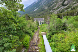 Looking down the water pipeline towards the power station. Power company uses a rail system to travel back and forth to the dam.