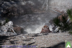 Observing a mud pot in the parking lot of Duck Lake Trail Head in Yellowstone National Park