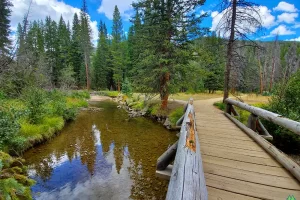 Besides trail signs, I like old bridges of wood or metal with Get Lost in America in Rocky Mountain National Park