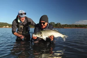 Fly Fishing Sardinia, Client with Sea Bass Exploring the 13 Best Places to Visit on Sardinia, Italy