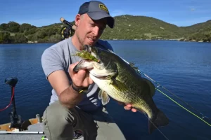 One of our guides with a bass Exploring the 13 Best Places to Visit on Sardinia, Italy