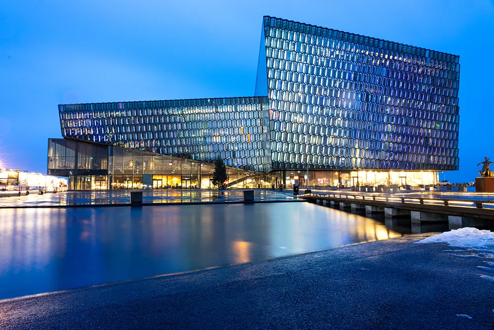 Harpa Concert Hall in Reykjavik Iceland while fly fishing with Get Lost in America in A great stop on your adventure of visiting the 9 best places to visit in Reykjavik Iceland.