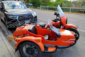 Motorcycles and sidecars one of the cool things in life. Parked on the street in Livingston