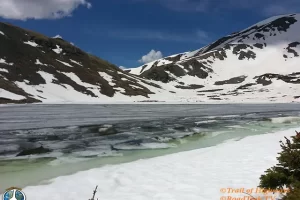 Ptarmigan Lake was still quite frozen when we arrived. We found a clear spot and all ate a snack and rest before heading back down. Get Lost in America