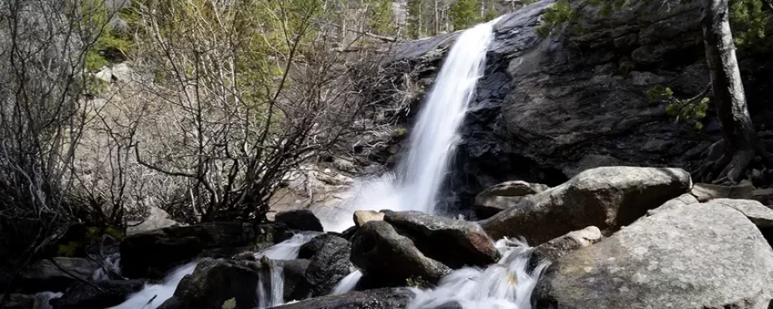 Our guide covers a hike Bridal Veil Falls, McGraw Ranch's history in Rocky Mountain National Park, and essential tips.