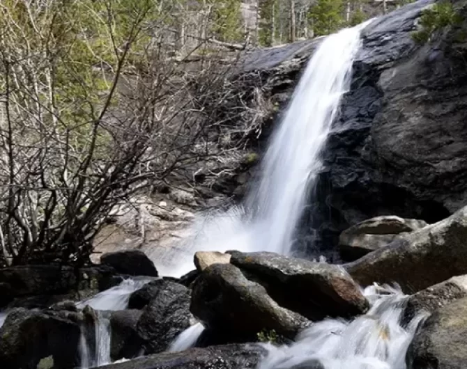 Our guide covers a hike Bridal Veil Falls, McGraw Ranch's history in Rocky Mountain National Park, and essential tips.