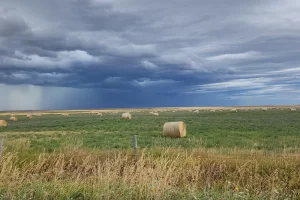 Backroads of Montana, hay field with crossing storm. Get Lost in America