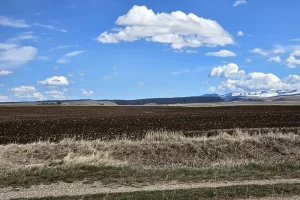 Smell of freshly turned over soil fills the air of central Montana. Get Lost in America.