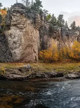 Top places to fly fish South Dakota, from Rapid Creek to Spearfish Canyon. Tips, best flies, regulations, to plan fly fishing adventure. Get Lost in America